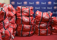 Hockey bags are shown stacked up outside the Montreal Canadiens locker room in Brossard, Que., Friday, April 14, 2023. THE CANADIAN PRESS/Graham Hughes