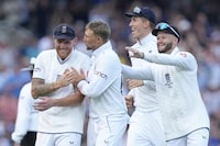 England's cricketers celebrate the dismissal of Australia's Cameron Green during day one of the second Ashes Test cricket match at Lord's Cricket Ground, London, England, Wednesday, June 28, 2023. (AP Photo/Kirsty Wigglesworth)