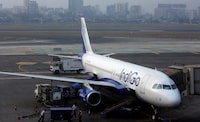 FILE PHOTO: An IndiGo Airlines Airbus A320 aircraft is pictured parked at a gate at Mumbai's Chhatrapathi Shivaji International Airport February 3, 2013. Picture taken February 3, 2013. REUTERS/Vivek Prakash/File Photo