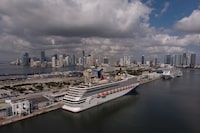 FILE PHOTO: The Carnival cruise ship Sunrise is seen docked at Miami Port, in Miami, Florida, U.S., June 18, 2022. Picture taken with a drone. REUTERS/Marco Bello/File Photo