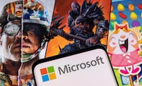 Microsoft logo is seen on a smartphone placed on displayed Activision Blizzard's games characters in this illustration taken January 18, 2022. REUTERS/Dado Ruvic/Illustration/File photo