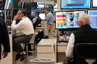 Traders work on the floor at the New York Stock Exchange in New York, Friday, June 2.