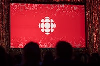 The CBC logo is projected onto a screen during the CBC's annual upfront presentation in Toronto on May 29, 2019. THE CANADIAN PRESS/Tijana Martin