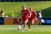 Canada's Maddy Grant, left, kicks the ball during their 29-14 win over the United States at the Rugby World Cup, in Aukland, New Zealand, in an Oct. 23, 2022, handout photo. THE CANADIAN PRESS/HO-Rugby Canada, Dave Lintott Photography, Craig Butland , *MANDATORY CREDIT*