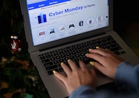 (FILES) This file photo taken on November 30, 2020 shows an ad on the Best Buy website for a Cyber Monday sale is displayed on a laptop  in Arlington, Virginia. - Online deals for gadgets, games, wine and clothes put "Cyber Monday" sales on track for record levels in the United States, according to an industry tracker. Adobe Digital Insights expected Cyber Monday to remain "the king of online shopping days," racking up sales of between $10.8 billion and $12.7 billion. (Photo by Olivier DOULIERY / AFP) (Photo by OLIVIER DOULIERY/AFP via Getty Images)