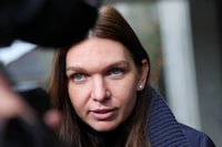 Tennis player Simona Halep of Romania speaks to the media, after a hearing for a doping case against her, at the Court of Arbitration for Sport (CAS) in Lausanne, Switzerland February 9, 2024. REUTERS/Denis Balibouse