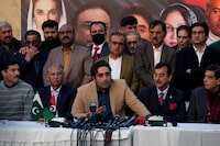 Bilawal-Bhutto Zardari, center bottom, Chairman of Pakistan People's Party speaks as party aids watch during a press conference regarding parliamentary elections, in Islamabad, Pakistan, Tuesday, Feb. 13, 2024. The main political rival of ex-Pakistani premier Imran Khan challenged him Tuesday to form a government if he had the support of the majority of newly elected lawmakers. The challenge by Shehbaz Sharif, who heads the Pakistan Muslim League party, follows national elections that showed candidates backed by Khan's Pakistan Tehreek-e-Insaf party won the most parliamentary seats but not enough to form a government alone. (AP Photo/Anjum Naveed)