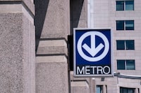 A direction sign to the Metro subway,is seen in Montreal on Tuesday, June 18, 2019. Montreal says public transit trips were up between 15 and 20 per cent among people age 65 and over in the six months after it made the service free for local seniors. THE CANADIAN PRESS/Paul Chiasson