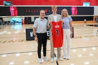 Toronto Raptors first round draft pick Gradey Dick, middle, is joined by his parents Bart, left, and Carmen during a media availability in Toronto, Monday, June 26, 2023. THE CANADIAN PRESS/Andrew Lahodynskyj