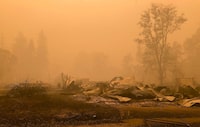 FILE - Fire damage is seen, Sept. 12, 2020, in Mill City, Ore. On Tuesday, March 5, 2024, a jury in Oregon ordered PacifiCorp to pay more than $42 million to 10 victims of devastating wildfires on Labor Day 2020 — the latest verdict in litigation that is expected to see the electric utility on the hook for billions in damages. (AP Photo/Gillian Flaccus, File)