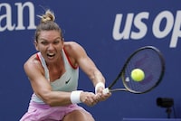 FILE - Simona Halep, of Romania, returns a shot to Daria Snigur, of Ukraine, during the first round of the U.S. Open tennis championships Aug. 29, 2022, in New York. Two-time Grand Slam champion Simona Halep has asked the Court of Arbitration for Sport to overturn the four-year ban she received for doping violations. The court said Tuesday, Oct. 24, 20234 it has registered Halep's appeal of the International Tennis Integrity Agency's decision in September. (AP Photo/Seth Wenig, File)