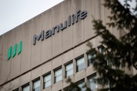 Signage is seen on Manulife Financial Corp.'s office in Toronto on Feb. 11, 2020. The insurance company says its earnings slipped in the third quarter as market losses and hurricane costs weighed. THE CANADIAN PRESS/Cole Burston