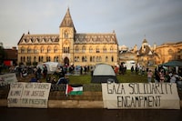 People gather at Oxford University, outside Oxford University Museum of Natural History, as students occupy parts of British university campuses to protest in support of Palestinians in Gaza, amidst the ongoing conflict between Israel and the Palestinian Islamist group Hamas, in Oxford, Britain, May 6, 2024. REUTERS/Hollie Adams