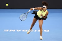 Naomi Osaka of Japan serves in her match against Tamara Korpatsch of Germany during the Brisbane International tennis tournament in Brisbane, Australia, Monday, Jan. 1, 2024. (AP Photo/Tertius Pickard)