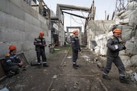 Workers check a transformer damaged by a Russian missile attack at DTEK's power plant in Ukraine, on Monday, April 1, 2024. Russia is attacking Ukraine’s energy sector with renewed intensity and alarming accuracy, signaling to Ukrainian officials that Russia is armed with better intelligence and fresh tactics in its campaign to annihilate the country’s power generation capacity. (AP Photo/Evgeniy Maloletka)