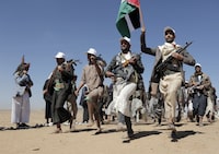 FILE - Houthi fighters march during a rally of support for the Palestinians in the Gaza Strip and against the U.S. strikes on Yemen outside Sanaa on Jan. 22, 2024. (AP Photo, File)
