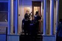 Police search a house in the neighbourhood after a gunman shot and wounded three college students of Palestinian descent in Burlington, Vermont, U.S. November 25, 2023 in a still image from video.  Courtesy Wayne Savage via REUTERS.   THIS IMAGE HAS BEEN SUPPLIED BY A THIRD PARTY. MANDATORY CREDIT