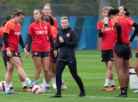 Canada’s national women’s soccer head coach Bev Priestman, centre, runs the team’s practice Thursday, October 26, 2023  in Montreal.THE CANADIAN PRESS/Ryan Remiorz