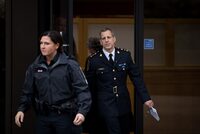 Abbotsford Police Chief Mike Serr, back right, leaves B.C. Supreme Court in New Westminster, B.C., on Monday February 3, 2020. British Columbia is appointing Serr as an administrator to act in place of the Surrey Police Board and assist the city's troubled transition from the RCMP. THE CANADIAN PRESS/Darryl Dyck