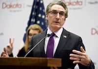 FILE - North Dakota Gov. Doug Burgum speaks at the state Capitol on April 10, 2020, in Bismarck, N.D. Burgum signed an abortion ban at six weeks of pregnancy — even in cases of rape or incest — into law on Monday, April 24, 2023. (Mike McCleary/The Bismarck Tribune via AP, File)