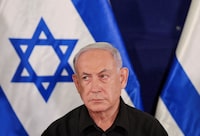 FILE PHOTO: Israeli prime minister Benjamin Netanyahu during a press conference with defense minister Yoav Gallant and Cabinet minister Benny Gantz  in the Kirya military base in Tel Aviv , Israel , 28 October  2023.    ABIR SULTAN POOL/Pool via REUTERS/File Photo