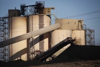 A conveyor belt transports coal at the Westmoreland Coal Company's Sheerness Mine near Hanna, Alta., Tuesday, Dec. 13, 2016. An environmental group is calling for improvements after Alberta's energy regulator announced that heavy rain had caused flooding and excessive surface runoff at energy sites, including coal mines. THE CANADIAN PRESS/Jeff McIntosh