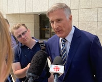 Maxime Bernier, leader of the People's Party of Canada, speaks to reporters in Winnipeg, Tuesday, May 16, 2023 after appearing in court and being fined $2,000 for breaking COVID-19 restrictions in Manitoba in 2021. THE CANADIAN PRESS/Steve Lambert