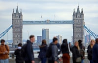 People walk over London Bridge looking at a view of Tower Bridge in the City of London financial district in London, Britain, October 25, 2023.  REUTERS/ Susannah Ireland/File Photo