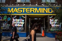 Mastermind has terminated about 270 employees as the toy retailer is turned over to new ownership. Pedestrians walk past a Mastermind Toys store on Queen St. East in Toronto, Tuesday, Sept. 19, 2017. THE CANADIAN PRESS/Chris Donovan