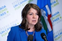 Alberta Premier Danielle Smith speaks to reporters in Ottawa on Friday, April 12, 2024. THE CANADIAN PRESS/Spencer Colby