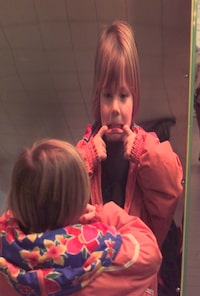 KOLLEY2.020499D               Picture taken on April 2/99
Easter weekend celebrations at Harbourfront in Toronto.Bethan Murray (6) makes funny faces in one of the mirrors in The Looking Glass Hall of Mirrors area. 
Photo by Tibor Kolley/Globe and Mail
