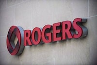 The Rogers Communications sign is shown at the company's headquarters in Toronto, April 25, 2012. Rogers Communications Inc. topped expectations as it reported a fourth-quarter profit of $419 million and a three per cent gain in revenue compared with a year ago. THE CANADIAN PRESS/Aaron Vincent Elkaim