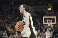 Iowa guard Caitlin Clark celebrates as time expires during the overtime win of an NCAA college basketball game against Nebraska in the final of the Big Ten women's tournament Sunday, March 10, 2024, in Minneapolis. (AP Photo/Abbie Parr)