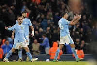 Manchester City's Rodri, right, celebrates after scoring his side's first goal during the English Premier League soccer match between Manchester City and Chelsea at the Etihad stadium in Manchester, England, Saturday, Feb. 17, 2024. (AP Photo/Dave Thompson)