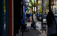 People shop in the Glebe community of Ottawa on Thursday, Oct. 15, 2020. Small businesses in Canada have received less than 10 per cent of the financial aid they were promised to help them offset the costs of the national price on carbon emissions. THE CANADIAN PRESS/Sean Kilpatrick