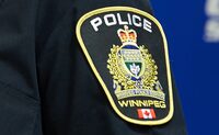A Winnipeg Police Service shoulder badge is seen on Sept. 2, 2021 at the Public Information Office in Winnipeg. Manitoba's police watchdog is investigating the death of a Winnipeg man after police shot and killed him while trying to apprehend him under the province's Mental Health Act. THE CANADIAN PRESS/David Lipnowski