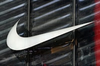 FILE PHOTO: The Nike swoosh logo is seen outside the store on 5th Avenue in New York, New York, U.S., March 19, 2019. REUTERS/Carlo Allegri/File Photo