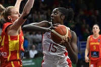Canada's Laeticia Amihere (R) holds the ball against Spain's Laura Gil (L) during the 2024 FIBA Women's Olympic Qualifying Tournament basketball match between Canada and Spain in Sopron, Hungary on February 9, 2024. (Photo by ATTILA KISBENEDEK / AFP) (Photo by ATTILA KISBENEDEK/AFP via Getty Images)