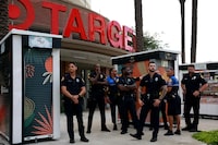 MIAMI, FLORIDA - JUNE 01: City of Miami police officers keep an eye on protesters outside of a Target store on June 01, 2023 in Miami, Florida. The protesters were reacting to Pride Month merchandise featuring the rainbow flag in support of the rights of the lesbian, gay, bisexual, transgender, and queer communities that had been sold at Target stores. Target removed certain items from its stores and made other changes to its LGBTQ+ merchandise after a backlash from some customers. (Photo by Joe Raedle/Getty Images)