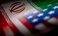 FILE PHOTO: The Iranian and U.S. flags are seen printed on paper in this illustration taken January 27, 2022. REUTERS/Dado Ruvic/Illustration/File Photo