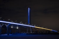 The Samuel de Champlain Bridge is shown lit up in the colours of Ukraine in Montreal, Saturday, February 26, 2022, in a show of support from the government of Canada for the Ukrainian people and all Ukrainian Canadians. THE CANADIAN PRESS/Graham Hughes