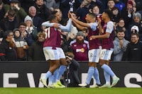 Aston Villa's Leon Bailey, left, celebrates after scoring his side's fourth goal during the English Premier League soccer match between Aston Villa and Nottingham Forest at the Villa Park stadium in Birmingham, England, Saturday, Feb. 24, 2024. (AP Photo/Rui Vieira)