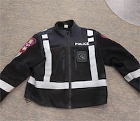 A Calgary Police uniform jacket is shown in this undated handout photo. A break-in at a uniform supply business in northeast Calgary last week has prompted a warning from police. THE CANADIAN PRESS/HO, City of Calgary *MANDATORY CREDIT*