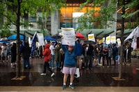 Members of the Writers Guild of Canada and their supporters gather outside the office building for both Amazon and Apple, for a rally in support of U.S. screenwriters, in downtown Toronto, Wednesday, June 14, 2023. THE CANADIAN PRESS/Tijana Martin