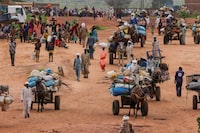 FILE PHOTO: People fleeing the violence in West Darfur, cross the border into Adre, Chad, August 4, 2023. REUTERS/Zohra Bensemra/File Photo