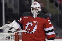 New Jersey Devils goaltender Jake Allen (34) before the first period of an NHL hockey game against the Winnipeg Jets on Thursday, March 21, 2024, in Newark, N.J. (AP Photo/Adam Hunger)