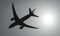 The consortium behind an airport overhaul in the Montreal area has shored up funding for the effort thanks to a $90-million loan from the Canada Infrastructure Bank. A plane is silhouetted as it takes off in Richmond, B.C. on Monday, May 13, 2019. THE CANADIAN PRESS/Jonathan Hayward