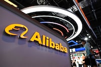 (FILES) The logo of Alibaba is seen at the World Artificial Intelligence Conference (WAIC) in Shanghai on July 6, 2023. Shares in Chinese e-commerce giant Alibaba plummeted on November 16, 2023, after the company said it would cancel the spinoff of its cloud computing arm because of US curbs on exports of advanced chips. Alibaba shares were down eight percent in late morning trade on Wall Street. The company had planned to split the group into six distinct entities, with the intention of taking them public. (Photo by WANG Zhao / AFP) (Photo by WANG ZHAO/AFP via Getty Images)