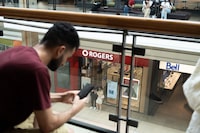 People use the wifi inside Toronot’s Fairview Mall on Friday, July 8, 2022. Yader Guzman/The Globe and Mail