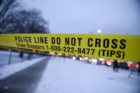 A 49-year-old man from Sydney, N.S. is facing a manslaughter charge following the death of a 51-year-old man this weekend. Police tape is seen at a scene in Toronto, Monday, Jan. 22, 2024. THE CANADIAN PRESS/Christopher Katsarov
